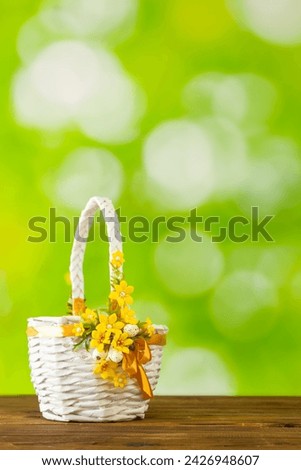 Easter white basket on a background of beautifully blurred greenery, Concept, spring season, happy Easter, copy space, vertical photo
