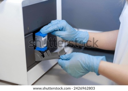a cartridge based nucleic acid amplification test for rapid tuberculosis diagnosis and rapid antibiotic susceptibility or rifampicin testing. real time pcr and Mycobacterium tuberculosis DNA Royalty-Free Stock Photo #2426962803