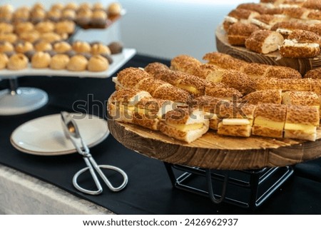 coffee break hotel during conference meeting, corporate revent with tea and coffee catering, decorated catering banquet table with variety of different pastry and bakery, with croissants and cookies Royalty-Free Stock Photo #2426962937