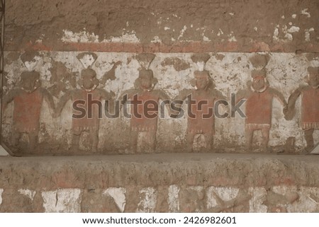 Iconography of the Moche Culture showing their deity Ai Apaec and Moche warriors performing ceremonial rites at the Huaca del Sol at the Archaeological Center in Trujillo, Peru. Royalty-Free Stock Photo #2426982601