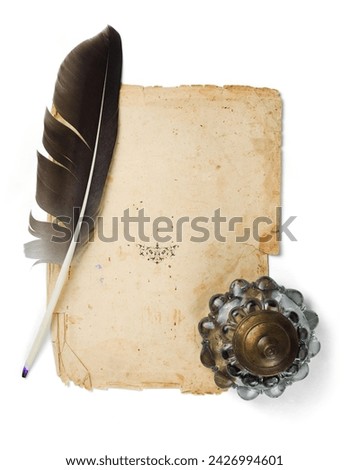 Quill pen with old manuscript and vintage glass inkwell. Isolated on a white background. Space for text