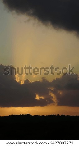 Dramatic clouds with sun rays, photo at Praia da Pipa - Rio Grande do Norte, Brazil
