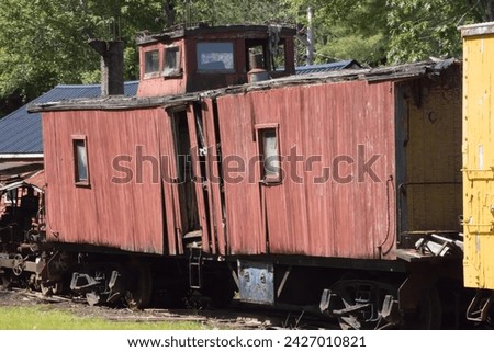 Old Red Caboose on a track Royalty-Free Stock Photo #2427010821