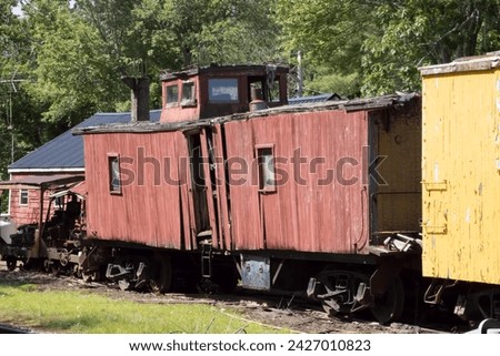 Old Red Caboose on a track Royalty-Free Stock Photo #2427010823