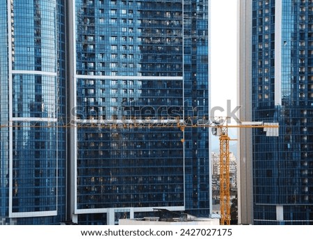 construction site of a skyscraper building with a yellow crane an exterior. Construction industry. skyscraper building. Modern Office Building 