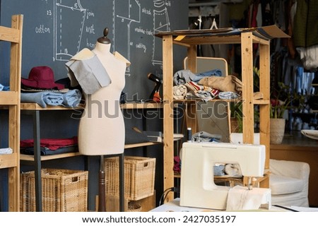 Background image of mannequin and sewing patterns in atelier studio workshop copy space Royalty-Free Stock Photo #2427035197