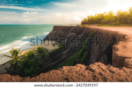 Beach seen from the top of the mountain, blue sky, nature, mountain, cliffs, Tropical climate, summer climate, beach day - Photo at Praia da Pipa - RN, Brazil