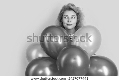 happy birthday woman hold balloons in studio. dreamy woman with balloon for birthday party