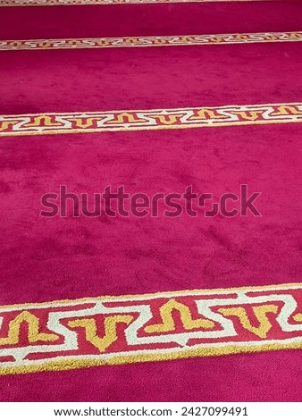 The carpet in the mosque is red