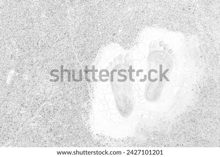 Footprints on cracked old cement floor top view grey background and space