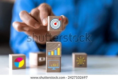 Hand holding wood block choose target icon business, target goal, market goal, consumer, digital marketing, strategy, action plan, achievement, success, financial growing, business development