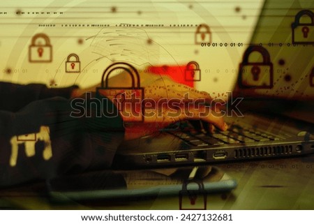 Cybersecurity with hands typing on a laptop overlaid with digital padlocks and binary code.