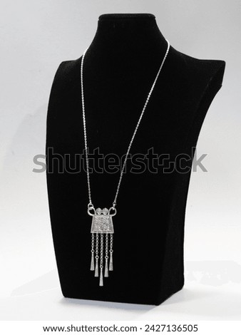 Handmade silver jewelry in tribal style on white background