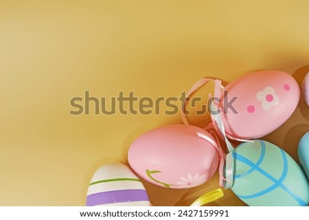 colorful Easter eggs on beige color backgrounds copy space stock photo