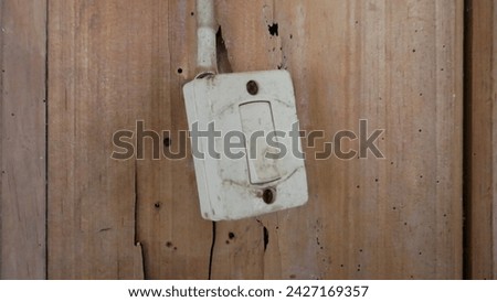 various kinds of old model light switches and old model electrical plugs that are still in use