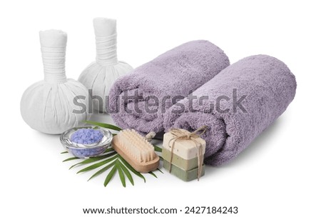 Different spa supplies and floral decor isolated on white