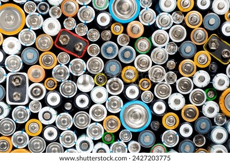 Close up of a large group of used batteries for recycling process Royalty-Free Stock Photo #2427203775