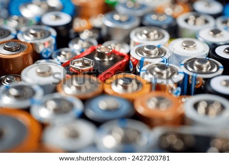Close up of a large group of used batteries for recycling process Royalty-Free Stock Photo #2427203781