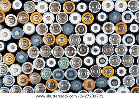 Close up of a large group of used batteries for recycling process Royalty-Free Stock Photo #2427203791