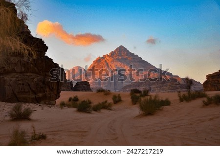 Wadi Rum is located within the Sandstone Mountain and Valley Region of southern Jordan the area is characterized by tall, near vertical mountains of iron-rich
