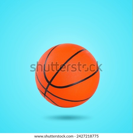One basketball ball in air on light blue background