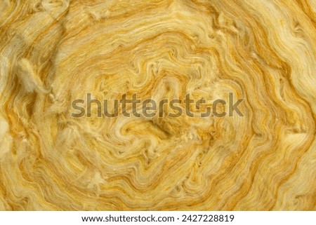 Texture of roll of glass wool batt insulation Royalty-Free Stock Photo #2427228819