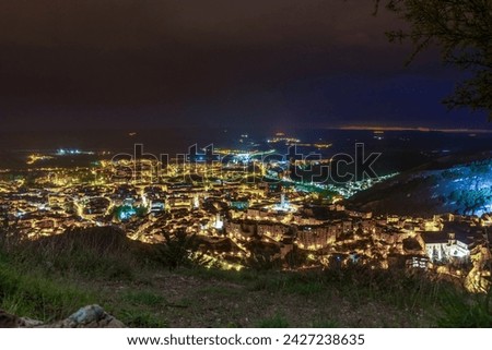 Spectacular views of the medieval city of Cuenca from the top of a viewpoint at night with the great city illuminated by lights. Castilla la Mancha. Spain. 