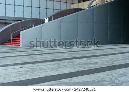 empty concrete floor in front of modern buildings in the downtown street. copy space for parking lot. Royalty-Free Stock Photo #2427240521