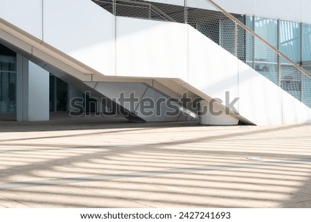 empty concrete floor in front of modern buildings in the downtown street. copy space for parking lot. Royalty-Free Stock Photo #2427241693