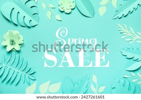 Text SPRING SALE, paper flowers and leaves on turquoise background
