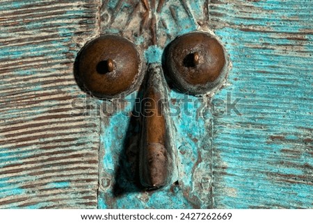 Macro shot of a wooden Kota reliquary figure from Gabon. Tribal African art, showcasing masterful craftsmanship and spiritual symbolism. Royalty-Free Stock Photo #2427262669