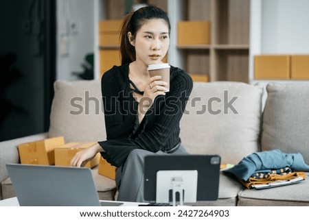 Young asian Woman Thinking and Working on sell online in cozy house, Modern Lifestyle of New Generation People.