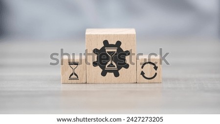 Wooden blocks with symbol of time management concept