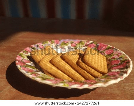  small quick bread usually made from flour, salt, and butter or vegetable shortening, with baking powder as a leavening agent. Royalty-Free Stock Photo #2427279261