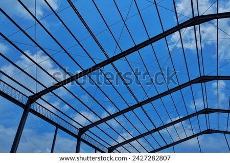 unfinished building pillars and blue sky Royalty-Free Stock Photo #2427282807