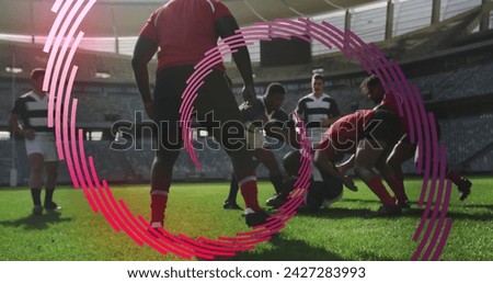 Image of red line spiral rotating over male rugby players during match. sport and competition concept, digitally generated image.