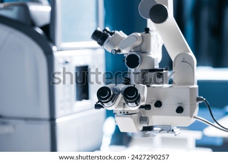 Interior of a modern ophthalmology operating room with modern equipment. The concept of new ophthalmological and modern technologies for vision correction and treatment. Royalty-Free Stock Photo #2427290257