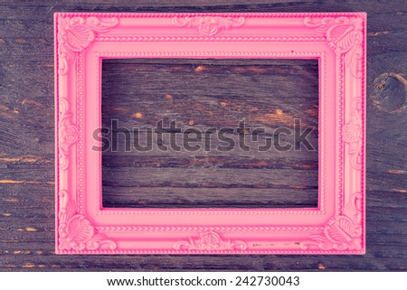 Photo frame on wooden background - vintage style effect picture