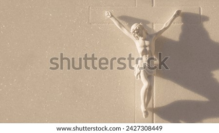 Happy Easter Day Sculpture of Holy Jesus Christ Crucified. Panoramic photography with space copy of Jesus carved in marble and cross for religion belief in spiritual God. Concept of Jesus crucified