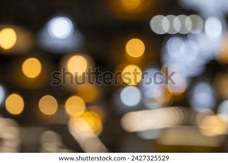Abstract bokeh of light texture on black background