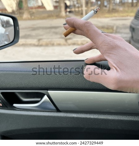 Macro photo cigarette. Stock photo smoking in car