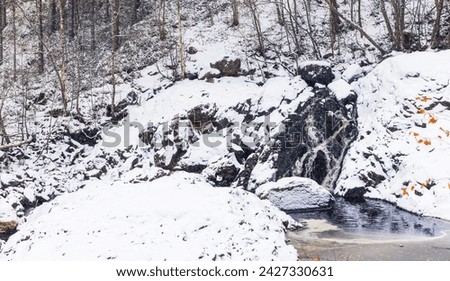 Waterfalls of Suna River on a cold cloudy winter day, landscape photo of Girvas village, Kondopoga District, Republic of Karelia, Russia