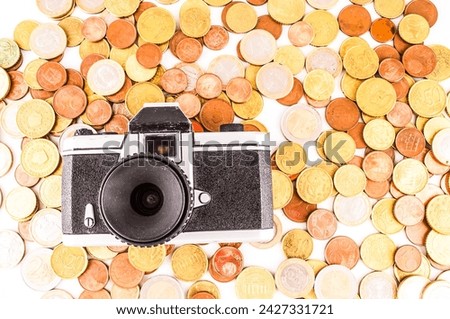 Picture of a Business Money Concept Idea, Photo Camera and Coins