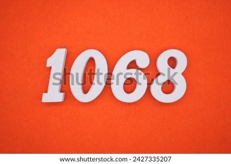 Orange felt is the background. The numbers 1068 are made from white painted wood.