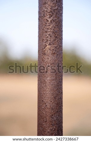 Rusty steel beam from metal stock isolated on Blurred background.