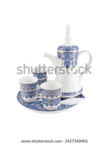 Porcelain Arabic traditional teapot, Coffeepot, cups and tray isolated on white background Royalty-Free Stock Photo #2427340401