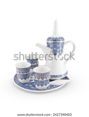 Porcelain Arabic traditional teapot, Coffeepot, cups and tray isolated on white background Royalty-Free Stock Photo #2427340403