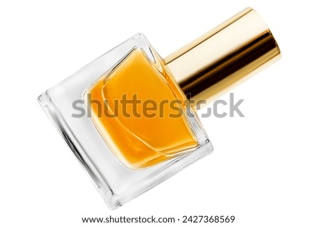 Amber color perfume glass bottle with golden cap isolated on white background