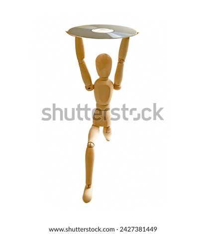 wood mannequin with CD-rom on white background Royalty-Free Stock Photo #2427381449