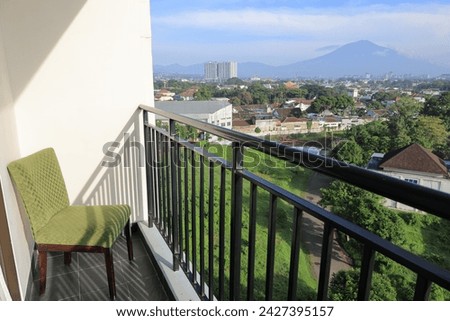 chair in balcony in the morning with mountain view at countryside home or homestay. Vacation, travel and trip concept